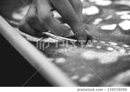 Close Up Fingers Creating Lines In Fine Sand Texture Close Up Fingers Creating Lines In Fine Sand Texture 139558099