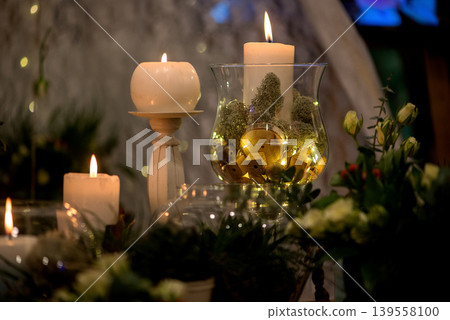 Warm Candle Light Composition With Glass And Natural Decor Warm Candle Light Composition With Glass And Natural Decor 139558100