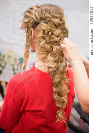Detailed View Of Curled Braided Hair With Soft Golden Highlights Detailed View Of Curled Braided Hair With Soft Golden Highlights 139558134