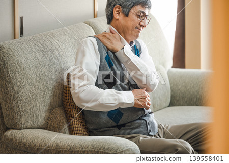 Senior man suffering from stiff neck 139558401