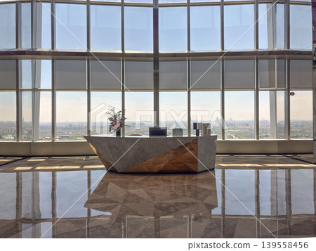 Luxury lobby of a skyscraper and panoramic city views Luxury lobby of a skyscraper and panoramic city views 139558456