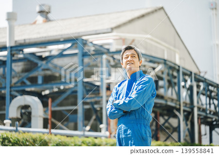 Portrait of a senior man in work clothes Portrait of a senior man in work clothes 139558841