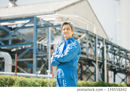 Portrait of a senior man in work clothes Portrait of a senior man in work clothes 139558842