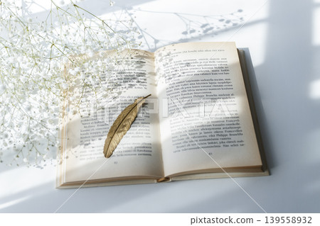 A peaceful reading time with baby's breath and a bookmark. 139558932