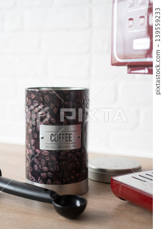 Coffee container and espresso machine on kitchen counter 139559233