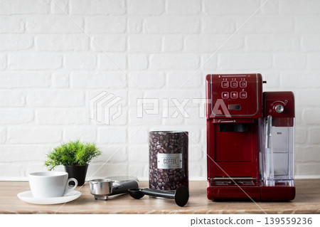 Coffee container and espresso machine on kitchen counter 139559236