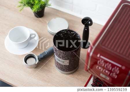 Coffee container and espresso machine on kitchen counter Coffee container and espresso machine on kitchen counter 139559239
