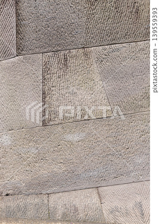 A background image of a flat, two-dimensional cutout of a model of a stone wall constructed using the traditional Japanese sanuki-zumi method (Kagoshima City). A background image of a flat, two-dimensional cutout of a model of a stone wall constructed using the traditional Japanese sanuki-zumi method (Kagoshima City). 139559393