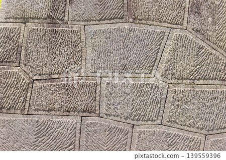 A two-dimensional photograph of a model of a stone wall constructed using the Kanaba method (Kagoshima City) as background material. A two-dimensional photograph of a model of a stone wall constructed using the Kanaba method (Kagoshima City) as background material. 139559396