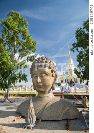 A part of unfinshed Buddha statue put on ground in Wat Saensuk Wisuthi Wararam, Buddhist temple in Bansaen, Chonburi, Thailand 139559741