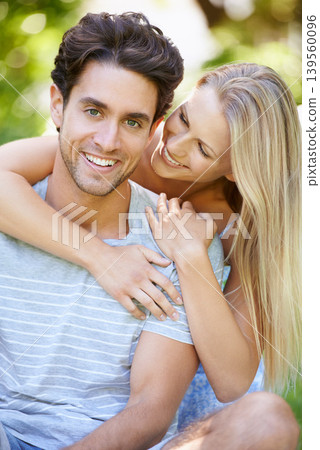 Couple, hug and happy in park with smile, love and commitment in healthy relationship. People on a date outdoor, portrait and care with trust, partner and bonding together for marriage and romance Couple, hug and happy in park with smile, love and commitment in healthy relationship. People on a date outdoor, portrait and care with trust, partner and bonding together for marriage and romance 139560096