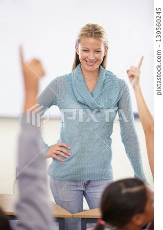 Hands in the air, woman and questions with students, teacher and knowledge in a classroom. School, educator and kids with answers, teaching and child development with a smile, learning and education Hands in the air, woman and questions with students, teacher and knowledge in a classroom. School, educator and kids with answers, teaching and child development with a smile, learning and education 139560245