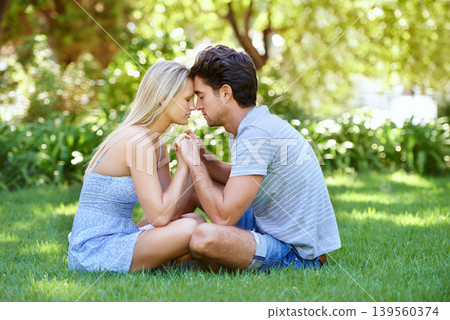 Couple, forehead touch and relax in park with love and commitment in healthy relationship. People on a date outdoor, peace and mindfulness with trust, partner and bonding together for marriage 139560374