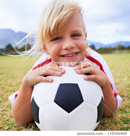 Girl, player and soccer ball with portrait, happy and ready for game, field and child. Outdoor, playful and sport for childhood, smile and athlete for match, alone and outside on football pitch Girl, player and soccer ball with portrait, happy and ready for game, field and child. Outdoor, playful and sport for childhood, smile and athlete for match, alone and outside on football pitch 139560409