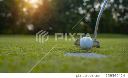 Golfers are putting golf in the evening golf course golf backglound. 139560424
