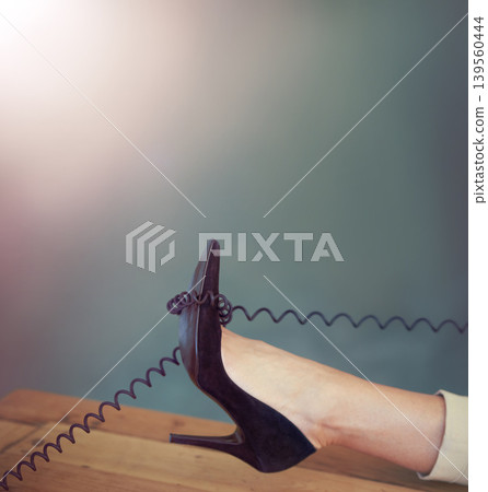 Shoes, table or relax woman with telephone cable in office for networking, consultation or communication. Work break, easy or closeup high heel of agent feet with phone call, landline or mockup space Shoes, table or relax woman with telephone cable in office for networking, consultation or communication. Work break, easy or closeup high heel of agent feet with phone call, landline or mockup space 139560444