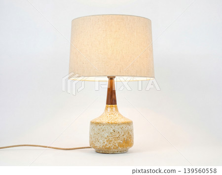Decorative table lamp with a textured ceramic base and fabric shade high tech kidney bean lighting decorative interior appliance business chandelier contemporary creative entertainment 139560558