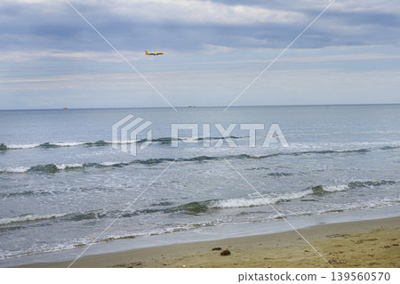 a plane landing as seen from the beach in Larnaka, Cyprus 139560570
