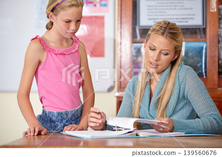 Woman, girl and explain paper in classroom, education and learning with portfolio, test with feedback on project. Teaching for development, exam and study, teacher with student and test in class Woman, girl and explain paper in classroom, education and learning with portfolio, test with feedback on project. Teaching for development, exam and study, teacher with student and test in class 139560676