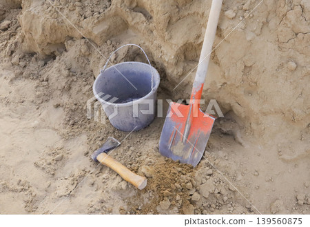 bucket with shovel and shovel on ground bucket with shovel and shovel on ground 139560875