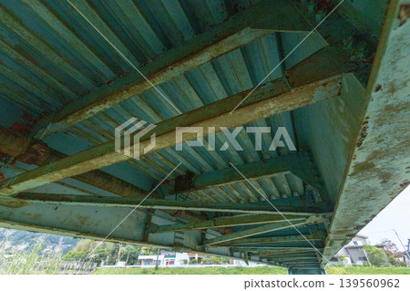 A stock photo of the underside of a weathered railway bridge. A stock photo of the underside of a weathered railway bridge. 139560962