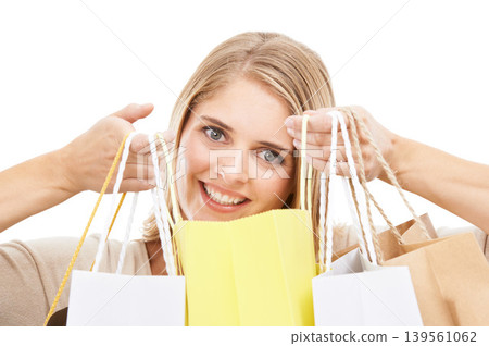 Portrait, woman and shopping bag in studio for retail sales, financial freedom or commerce savings from market white background. Face of happy customer with gift bags for deal, discount and promotion Portrait, woman and shopping bag in studio for retail sales, financial freedom or commerce savings from market white background. Face of happy customer with gift bags for deal, discount and promotion 139561062