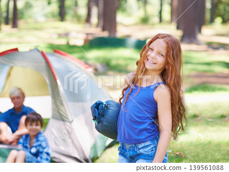 Sleeping bag, camping or portrait of happy child in forest on adventure or holiday vacation in nature. Relax, start or girl with smile in park, garden or park ready for experience, travel or wellness Sleeping bag, camping or portrait of happy child in forest on adventure or holiday vacation in nature. Relax, start or girl with smile in park, garden or park ready for experience, travel or wellness 139561088