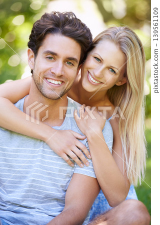 Couple, hug and portrait in park with smile, love and commitment in healthy relationship. People on date outdoor, happiness and care with trust, partner and bonding together for marriage and romance Couple, hug and portrait in park with smile, love and commitment in healthy relationship. People on date outdoor, happiness and care with trust, partner and bonding together for marriage and romance 139561109