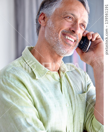Mature, smile or happy man on a phone call listening or talking for communication to relax. Confident, retirement or male senior person in home calling to chat in conversation or speaking on mobile Mature, smile or happy man on a phone call listening or talking for communication to relax. Confident, retirement or male senior person in home calling to chat in conversation or speaking on mobile 139561191