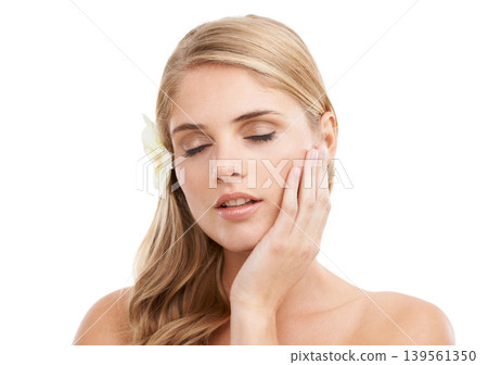 Woman, flower in hair for beauty and dermatology, natural cosmetics and nature on white background. Skincare, wellness and self care with plant, eco friendly with haircare and shine in studio Woman, flower in hair for beauty and dermatology, natural cosmetics and nature on white background. Skincare, wellness and self care with plant, eco friendly with haircare and shine in studio 139561350
