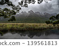 Dramatic cloudy sky over Earl Mountains and Mirror Lakes, Fiordland National Park, New Zealand. 139561813