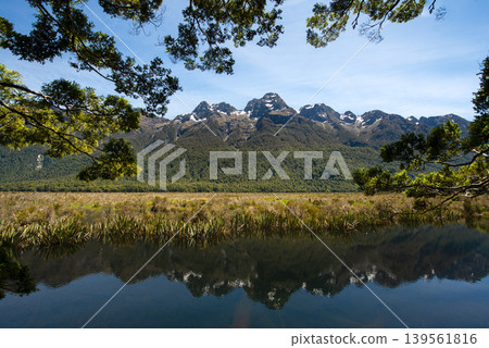 Reflection of Earl Mountains in Mirror Lakes along Milford Sound road, South Island, New Zealand. Reflection of Earl Mountains in Mirror Lakes along Milford Sound road, South Island, New Zealand. 139561816