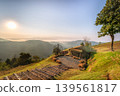 Scenic Sunrise Over Mountain Landscape with Rustic Cabin in Chiangrai 139561817
