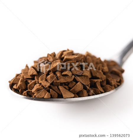 Instant coffee granules spoon macro isolated Instant coffee granules spoon macro isolated 139562073