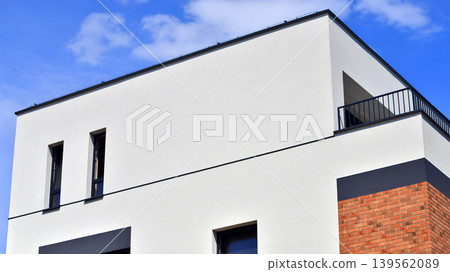 Contemporary apartment building in city. Residential building with balconies and modern facade. 139562089