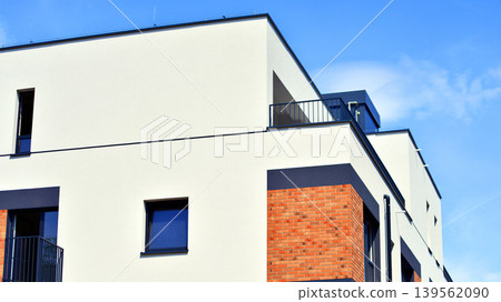 Contemporary apartment building in city. Residential building with balconies and modern facade. Contemporary apartment building in city. Residential building with balconies and modern facade. 139562090