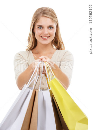 Portrait, happy woman and shopping bag in studio for retail sales, financial freedom or commerce savings from market white background. Wealthy customer giving gift bags of deal, discount or promotion Portrait, happy woman and shopping bag in studio for retail sales, financial freedom or commerce savings from market white background. Wealthy customer giving gift bags of deal, discount or promotion 139562192