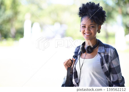 Woman, portrait and backpack on campus or headphones for entertainment, streaming or learning. Female person, face and student at college academy or outdoor nature for university, relax or summer Woman, portrait and backpack on campus or headphones for entertainment, streaming or learning. Female person, face and student at college academy or outdoor nature for university, relax or summer 139562212