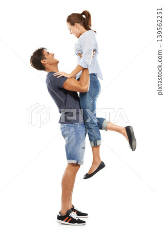Happy couple, hug and lifting for love, support or care in relationship on a white studio background. Man and woman smile in joy for embrace, marriage or affection together in trust on mockup space 139562251
