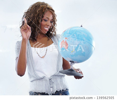 Happy black woman, teacher and 3D of earth globe for geography, history or planet on a white studio background. African female person or educator smile holding the world or map for learning locations Happy black woman, teacher and 3D of earth globe for geography, history or planet on a white studio background. African female person or educator smile holding the world or map for learning locations 139562505