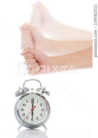 Person, hand and hitting alarm clock for alert, wakeup or deadline on a white studio background. Closeup of fist slamming down on time for stop in motion blur, schedule or management for planning 139562511