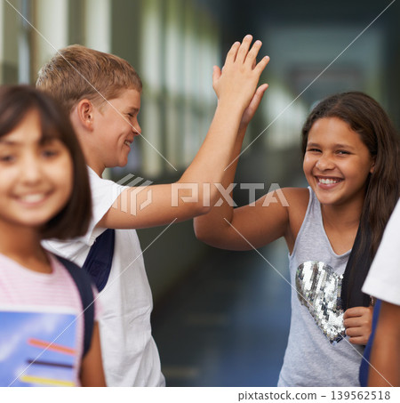 Children, students high five and support at school for learning success, education achievement and excited in hallway. Group, friends and portrait of girl with hands together for motivation and yes 139562518
