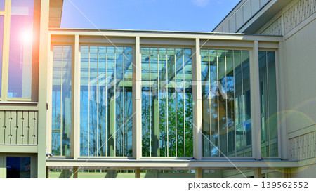 A fragment of a low-rise office building in the classical style. Modernity and tradition in office architecture. 139562552