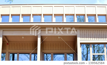 A fragment of a low-rise office building in the classical style. Modernity and tradition in office architecture. 139562564