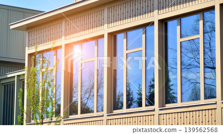 A fragment of a low-rise office building in the classical style. Modernity and tradition in office architecture. A fragment of a low-rise office building in the classical style. Modernity and tradition in office architecture. 139562568