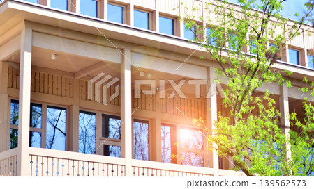 A fragment of a low-rise office building in the classical style. Modernity and tradition in office architecture. A fragment of a low-rise office building in the classical style. Modernity and tradition in office architecture. 139562573
