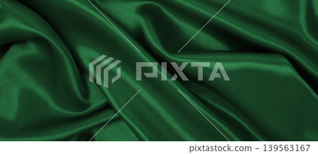 Smooth elegant green silk or satin luxury cloth texture as abstract background. Luxurious background design Smooth elegant green silk or satin luxury cloth texture as abstract background. Luxurious background design 139563167