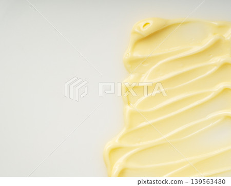 Mayonnaise texture and copy space spread across a white background 139563480