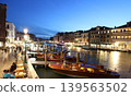 A night view of the Grand Canal from the Rialto Bridge in the old town of Venice, Italy. 139563502