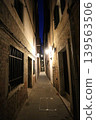 Nighttime view of an alleyway in the San Marco district of Venice's old town, Italy. 139563506